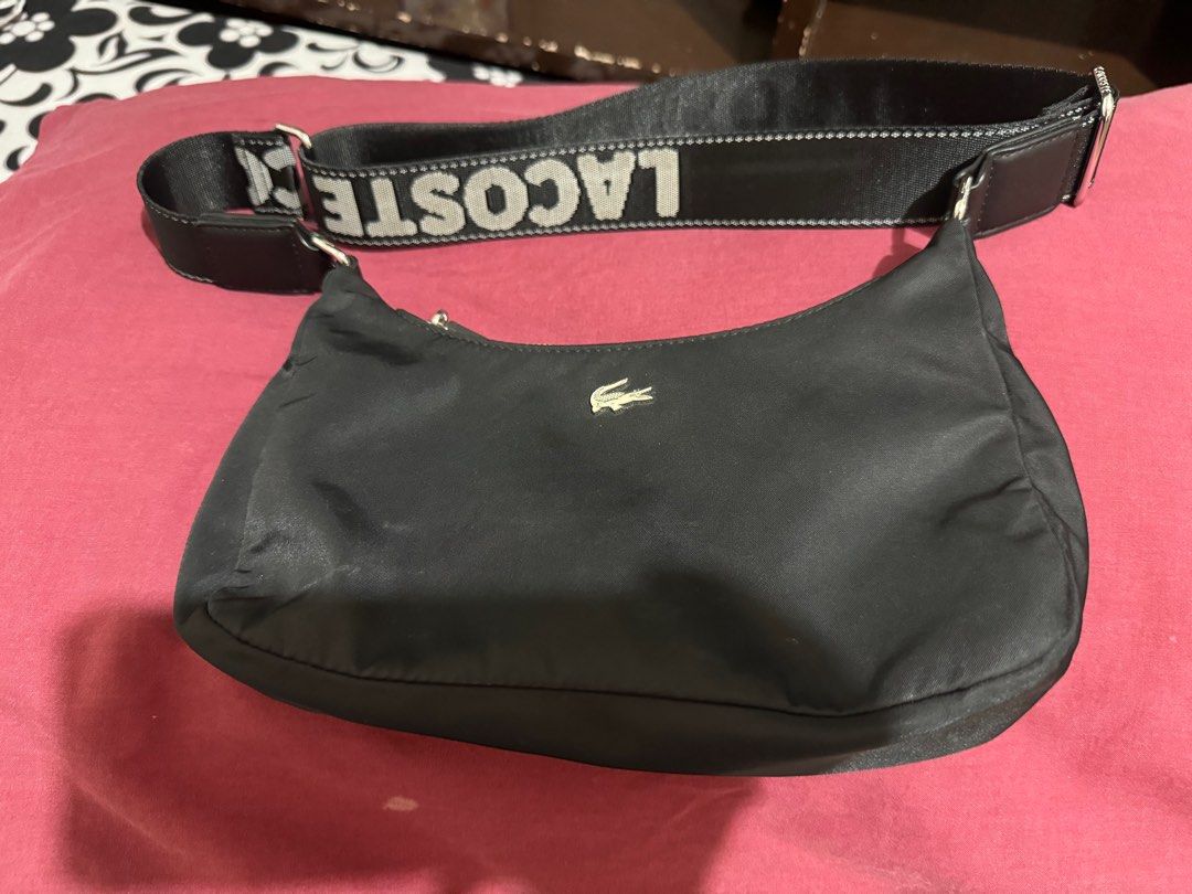Lacoste nylon sling bag (Category: Luxury Bags & Wallets) located in Quezon City. Submitted by mmauthenticshop (Listing ID 1289322500, Image 1). Description: Lacoste nylon sling bag Used once. Like new No issue or anything Original price is 7k plus 5,000 last price na po! Thank you Thanks!.