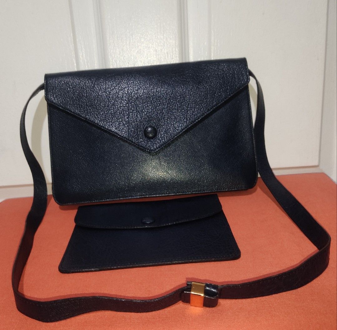 Preloved FRANCOIS VILLON Paris (Category: Cross-body Bags) located in Pasig City. Submitted by bcthriftedzoneonlineshop (Listing ID 1289324247, Image 3). Description: * Cowhide leather material * In- mid night blue color * Gold hardware * Adjustable and removable strap available * Envelope Type Sling Bag * Can be used as a clutch bag * Suede leather lining with 1 open pocket inside the bag * Comes with a leather pouch * Signs of usage bag ( strap