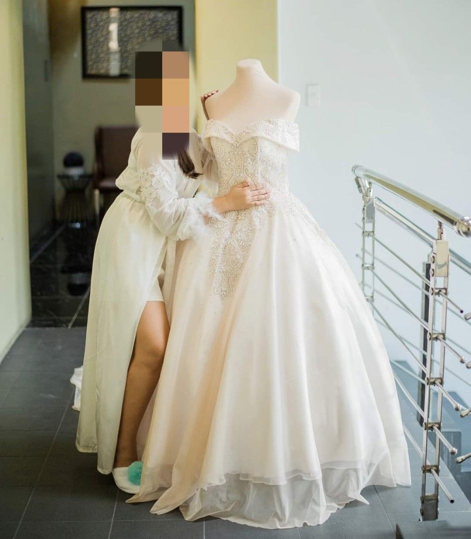 Wedding Gown S-M (Category: Evening dresses & gowns) located in Quezon City. Submitted by trishopstuff (Listing ID 1289329056, Image 1). Description: Used only once, dry cleaned already. Small to medium size Perfect for heights 4'8"-5'0 ft Long train off shoulder wedding gown Freebies: 3-layer petticoat and veil I also have other wedding stuff up for sale, just ask. Location: Bulacan, QC, Manila Buy at your own risk. No return, no refund. Payment