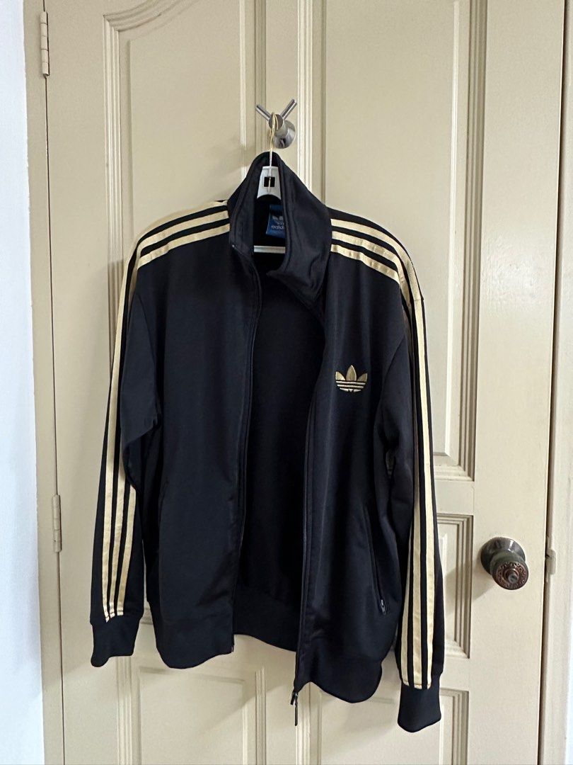 Adidas jacket 2025 gold stripes