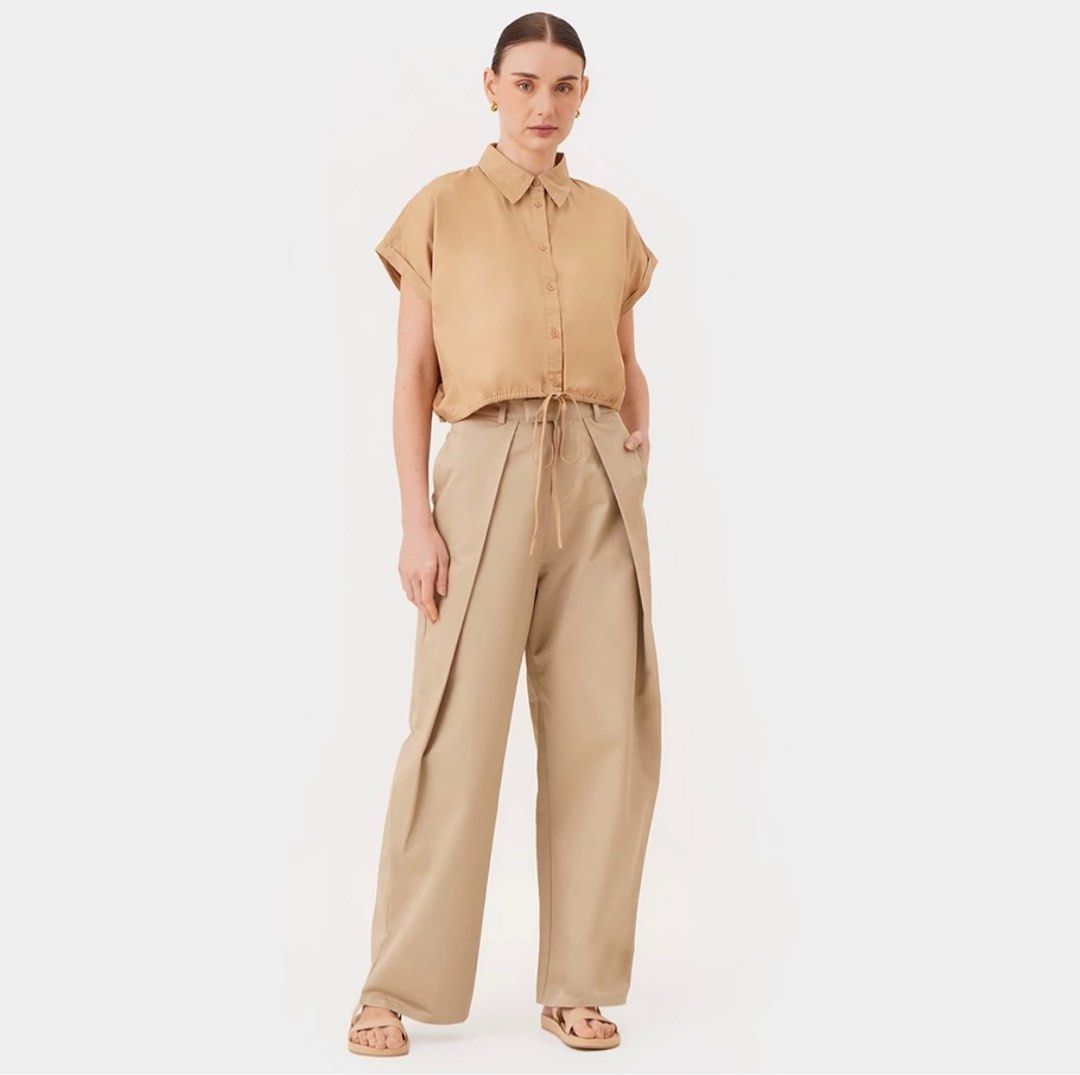 Bocu Cap Sleeve Draw Hem Cropped Shirt (Category: Blouses) located in Caloocan City. Submitted by gold_m (Listing ID 1289541022, Image 1). Description: - Fit: Boxy - Design Details: Regular Collar, Button Up, Cap Sleeves with Fixed Cuff, Shirred Back Yoke, Adjustable Self Tie Hem - Material Composition: 100% Cotton.