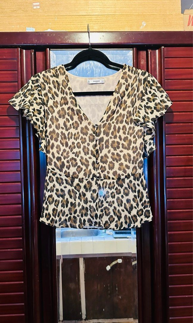 Leopard print blouse (Category: Blouses) located in Quezon City. Submitted by declutterr (Listing ID 1289495649, Image 1). Description: Used once Elegant short flutter sleeve; with lining, not sheer Wear business or casual.