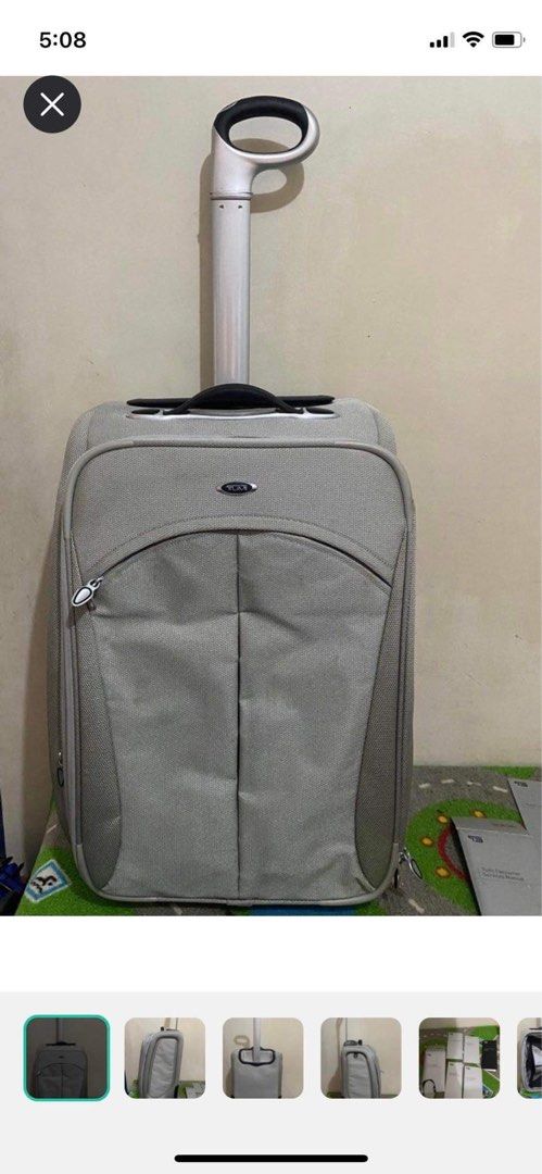 Original TUMI luggage (Category: Luggage) located in Mandaluyong City. Submitted by gabbie_0708 (Listing ID 1289513355, Image 1). Description: Very sturdy, can last for several years Inside is like new, with suit compartment Comes with papers 2 wheels Honest issue: has cracks in the rubber of the wheels Crack in the brand plate.