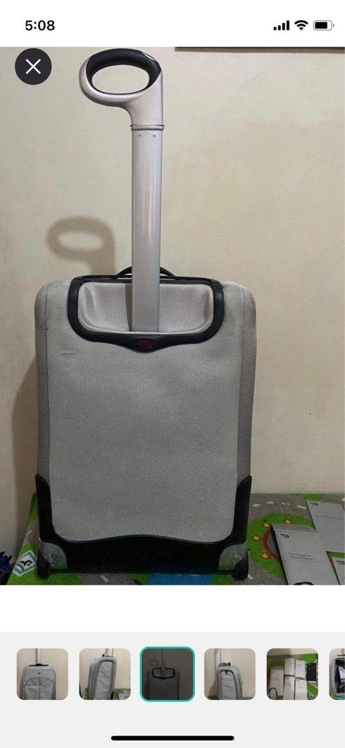 Original TUMI luggage (Category: Luggage) located in Mandaluyong City. Submitted by gabbie_0708 (Listing ID 1289513355, Image 3). Description: Very sturdy, can last for several years Inside is like new, with suit compartment Comes with papers 2 wheels Honest issue: has cracks in the rubber of the wheels Crack in the brand plate.