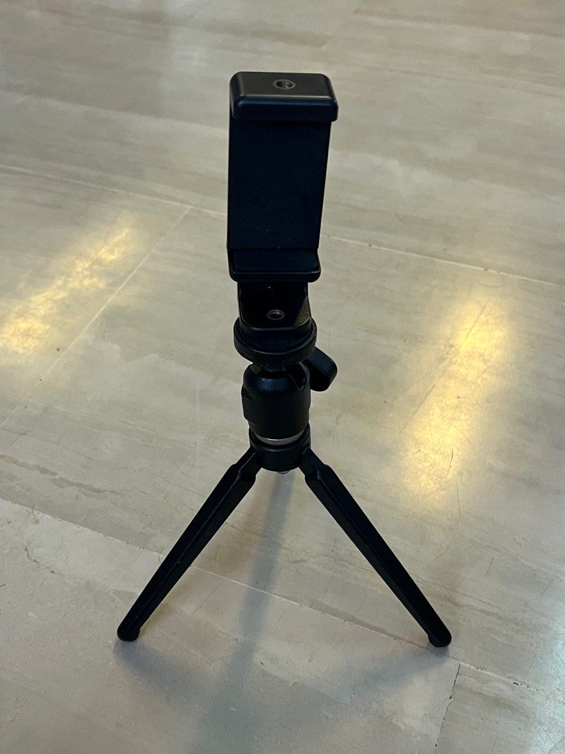 Tripod (Category: Tripods & Monopods) located in Singapore. Submitted by creativeleonard (Listing ID 1289673307, Image 5). Description: This is a made in Italy 420 pro ball head tripod fitted with an adapter for your mobile phone for vlogs etc. Very pro, very secure. Of course, you can also fit in a base for your small DSLR of point and shoot camera. Very sturdy and comfortable to hold. .