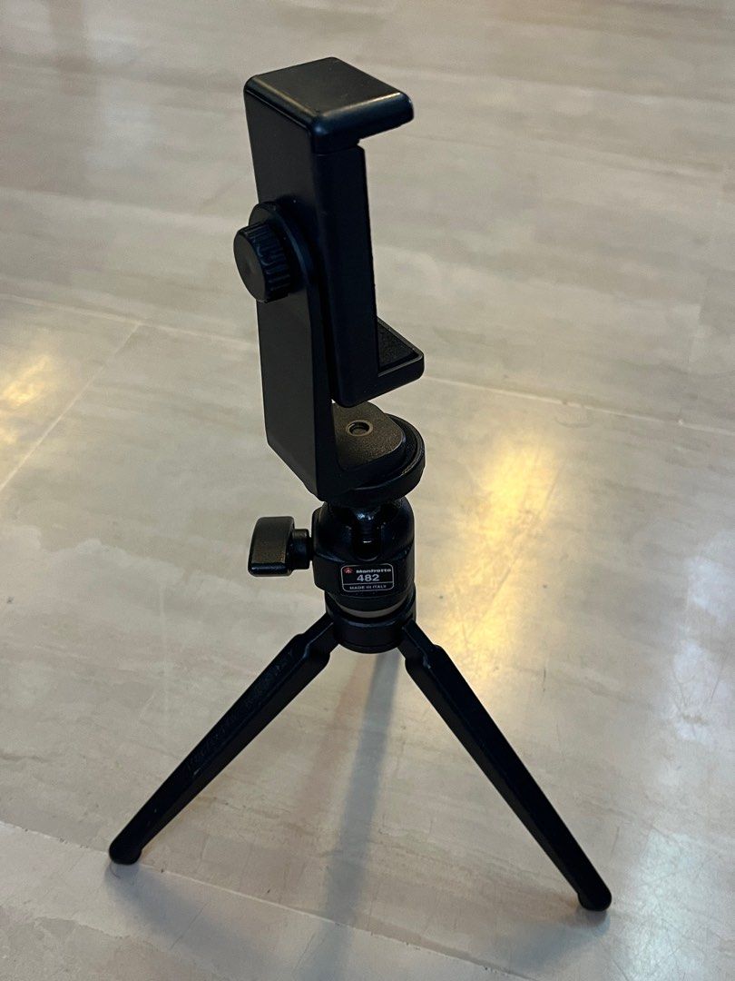 Tripod (Category: Tripods & Monopods) located in Singapore. Submitted by creativeleonard (Listing ID 1289673307, Image 4). Description: This is a made in Italy 420 pro ball head tripod fitted with an adapter for your mobile phone for vlogs etc. Very pro, very secure. Of course, you can also fit in a base for your small DSLR of point and shoot camera. Very sturdy and comfortable to hold. .