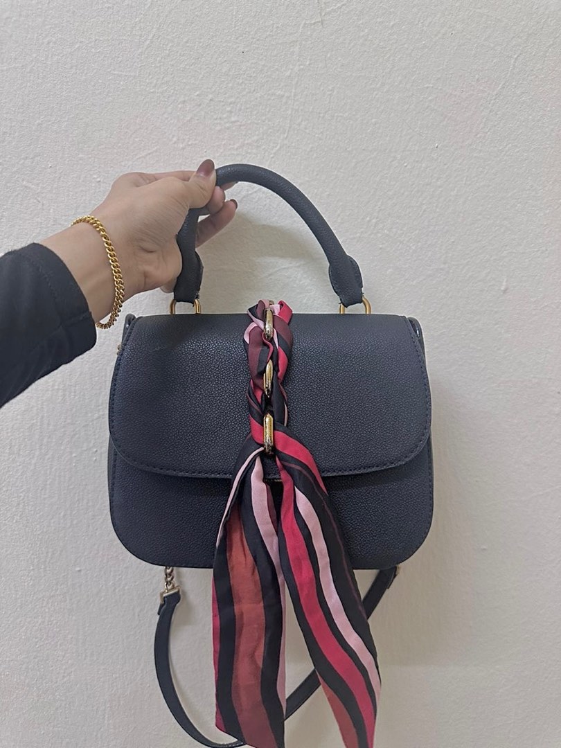 Braided front outlet flap bag