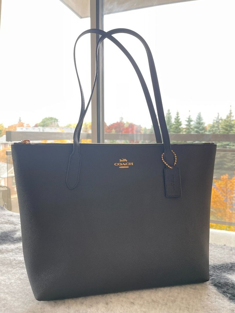 COACH Zip Top Tote (Available in Black) (Category: Luxury Bags & Wallets) located in Cavite. Submitted by mgracefernandez14 (Listing ID 1289866000, Image 2). Description: COACH Zip Top Tote (Available in Black and Chalk) Black - 1pc available on hand Chalk - SOLD Dark Pine - SOLD Crossgrain leather Inside cell phone and multifunction pockets Zip-top closure, fabric lining Handles with 10" drop 11 1/2" (L) x 9 1/2" (H) x 4 1/2" (W) Comes with tag 