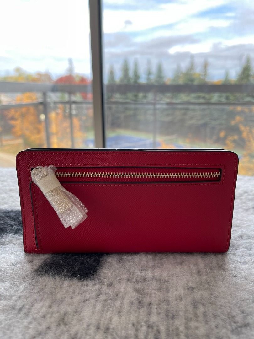 KATE SPADE Madison Large Slim Fold Wallet – Candied Cherry (Category: Luxury Bags & Wallets) located in Cavite. Submitted by mgracefernandez14 (Listing ID 1289854780, Image 3). Description: 1pc available Measurements 6.73" W x 3.54" H x 0.94" D Features Metal Pinmount Logo Closure Type: flap with magnetic snap closure, flap with mag snap closure Dust Bag Included: No Materials Glitter fabric Lining: Two-way Script Logo Lining 100% Original – Purc
