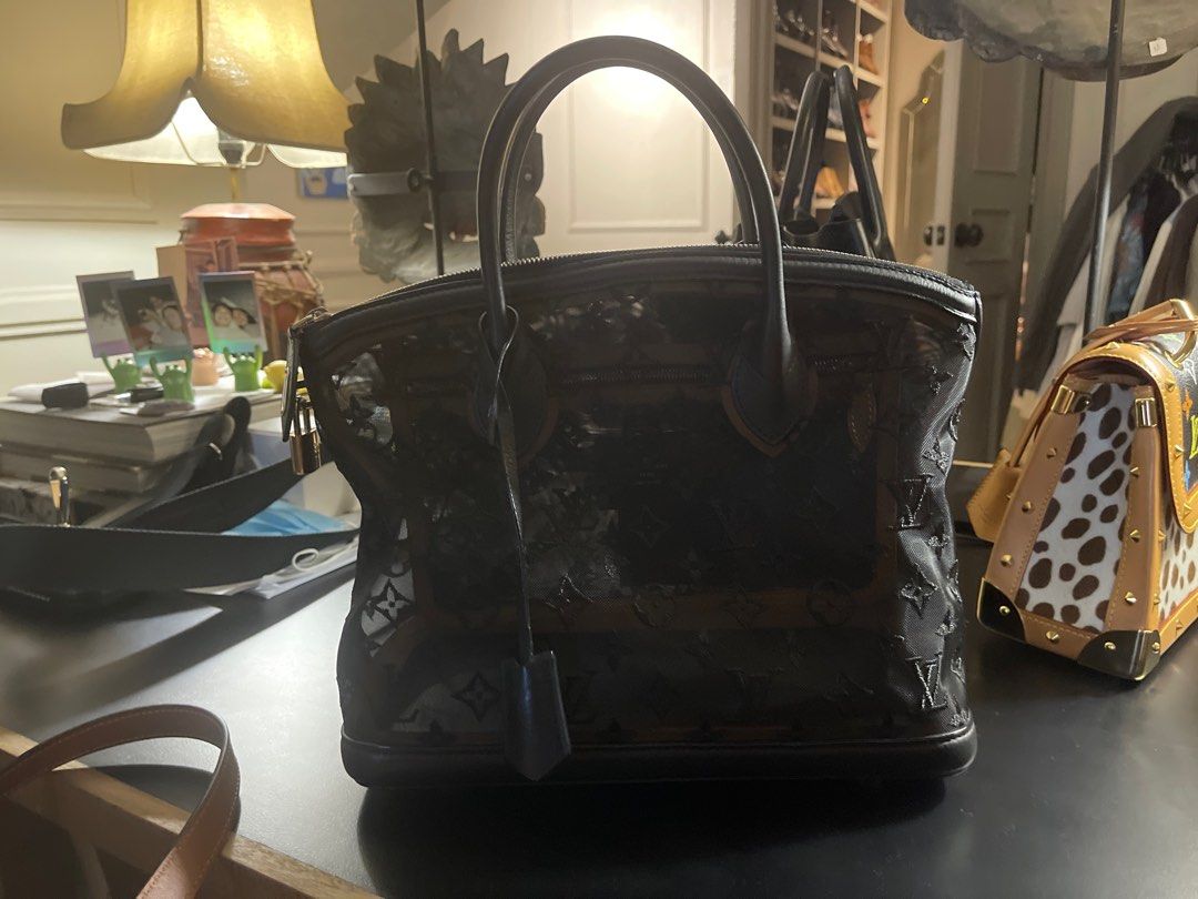 Louis Vuitton Limited Edition Transparence Lockit Bag (Category: Luxury Bags & Wallets) located in Mandaluyong City. Submitted by olachicoas (Listing ID 1289678828, Image 3). Description: 2012 Louis Vuitton Limited Edition Lockit Bag Nior (Black) Transparence Date Code: FO3172 30 cm L x 25 cm H x 15 cm D.
