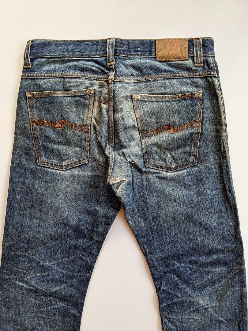Nudie ripped hot sale jeans