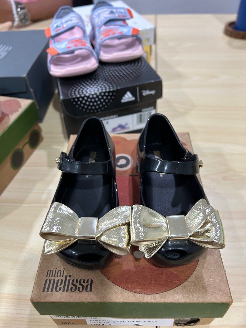 Preloved Original Black Gold Mini Melissa Shoes size US 6 Babies Kids Babies Kids Fashion on Carousell