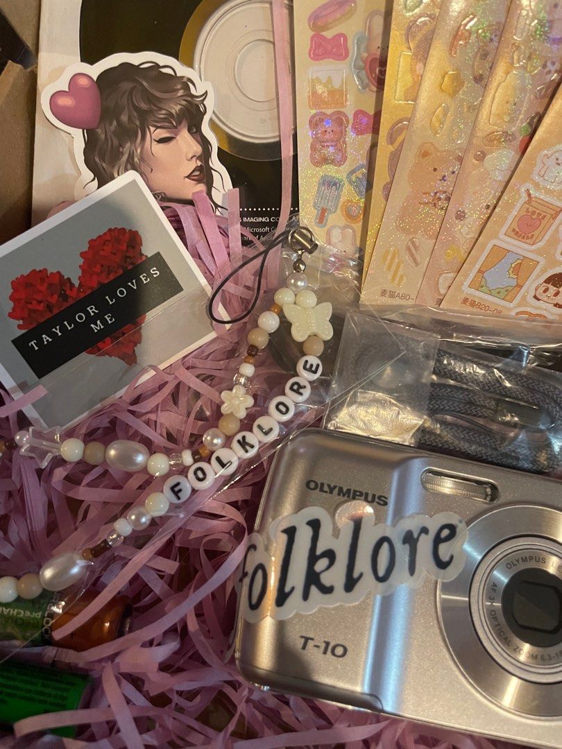 Taylor Swift Folklore Olympus T-10 Digicam Set (Category: Cameras) located in Manila. Submitted by stefandraboutique (Listing ID 1289742390, Image 1). Description: Perfect for eras tour! FOLKLORE digicam set Olympus T-10 silver 3999 php only 💕brand new 💕with new rechargeable batteries 💕ts digicam charm 💕digicam stickers 💕removable ts decal message us to order!.