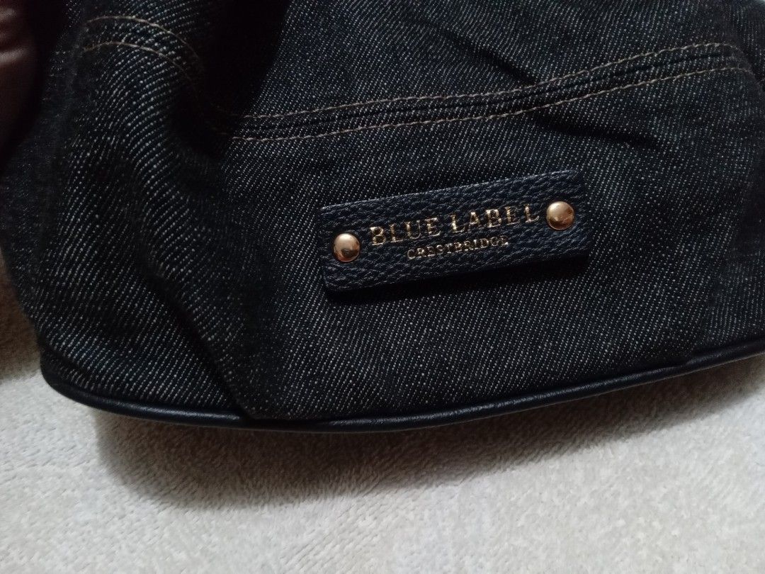 Burberry bucket bag (Category: Luxury Bags & Wallets) located in Manila. Submitted by monchiing (Listing ID 1290040949, Image 2). Description: burberry blue label bucket bag denim dark blue fabric will provide gold chain strap 9.5/10 bag condition.