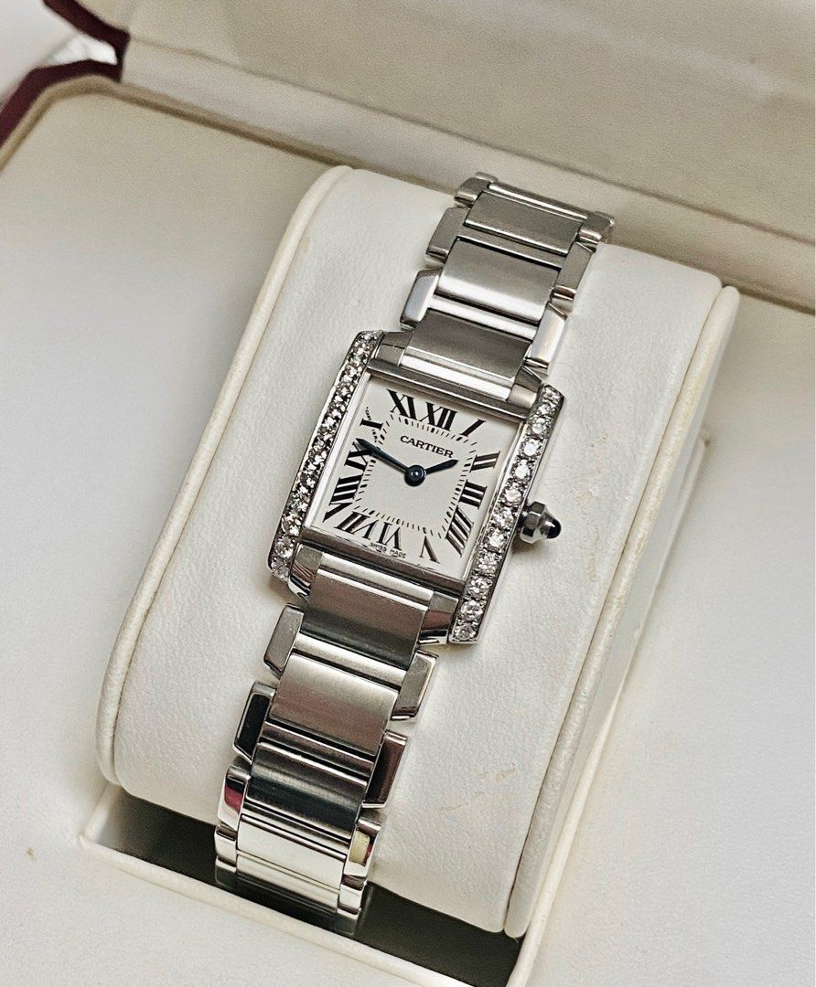Cartier Tank Diamonds (Category: Women's Watches) located in Quezon City. Submitted by clicksmileph (Listing ID 1288421135, Image 2). Description: Cartier Tank Diamonds Details: Quartz Movement 24 Natural Diamonds (Bezel) Blue Cabochon Crown 20x25mm Case diameter 16cm Wrist Size Clean White Dial 9.5/10 with Like-New Elegant and Still Presentable Guaranteed Authentic Set with: Watch, Original Box, Manuals, Meet-up by appointment: Trinoma / Makati 