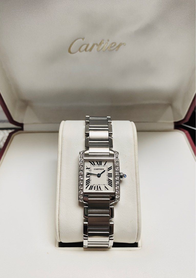 Cartier Tank Diamonds (Category: Women's Watches) located in Quezon City. Submitted by clicksmileph (Listing ID 1288421135, Image 3). Description: Cartier Tank Diamonds Details: Quartz Movement 24 Natural Diamonds (Bezel) Blue Cabochon Crown 20x25mm Case diameter 16cm Wrist Size Clean White Dial 9.5/10 with Like-New Elegant and Still Presentable Guaranteed Authentic Set with: Watch, Original Box, Manuals, Meet-up by appointment: Trinoma / Makati 
