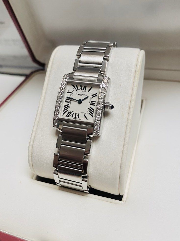 Cartier Tank Diamonds (Category: Women's Watches) located in Quezon City. Submitted by clicksmileph (Listing ID 1288421135, Image 1). Description: Cartier Tank Diamonds Details: Quartz Movement 24 Natural Diamonds (Bezel) Blue Cabochon Crown 20x25mm Case diameter 16cm Wrist Size Clean White Dial 9.5/10 with Like-New Elegant and Still Presentable Guaranteed Authentic Set with: Watch, Original Box, Manuals, Meet-up by appointment: Trinoma / Makati 