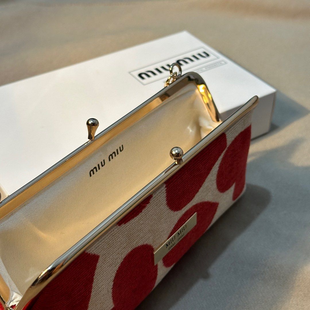 MIUMIU RED HEART SLING WALLET ❤️💄 (Category: Luxury Bags & Wallets) located in Rizal. Submitted by thetopspotfashionboutique (Listing ID 1290098193, Image 3). Description: - complimentary gift / gift with purchase from miumiu parfums 💄 - can fit big phones, wallets and make ups 💄💋 - comes with box.