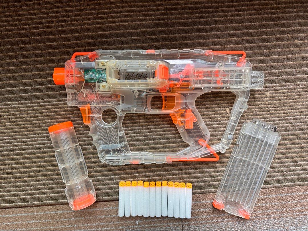 Nerf Modulus Evader (Category: Action & Battle Toys) located in Singapore. Submitted by please_buy_from_meme (Listing ID 1289965099, Image 3). Description: Great condition, rarely used Gun gun lights up when front button pressed. All original Parts included, including magazine and barrel which lights up too. Includes 12 glow in the dark waffle head darts No batteries included .