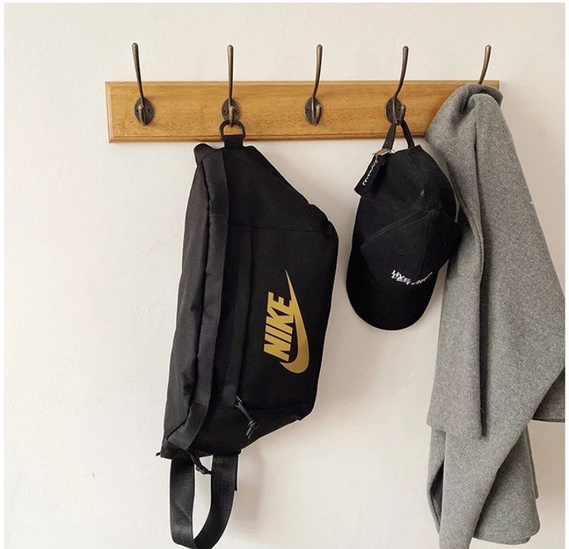nike belt bag black and gold