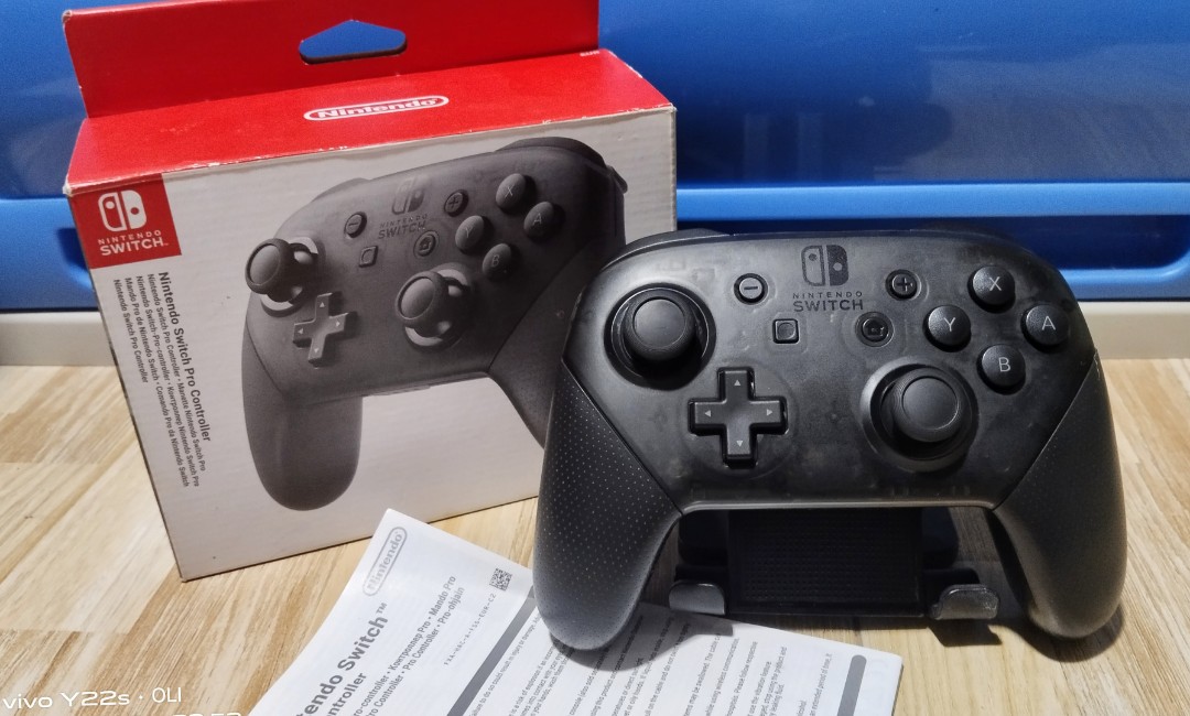 https://media.karousell.com/media/photos/products/2024/2/27/nintendo_switch_pro_controller_1709047519_7346627a.jpg