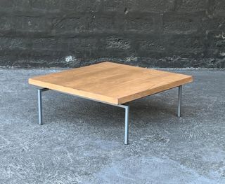 Post modern wooden coffee table with steel legs