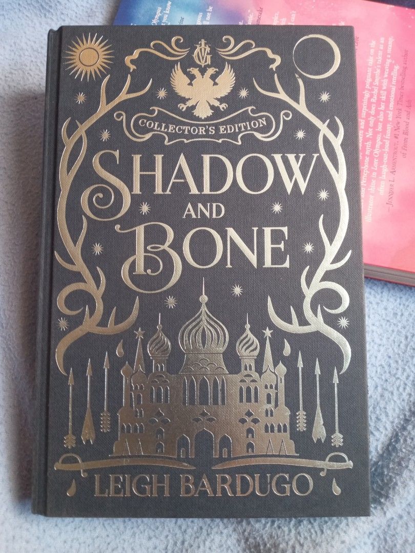 Shadow and Bone Collector’s Edition (Category: Storybooks) located in Pasig City. Submitted by thewundersmith (Listing ID 1289960248, Image 1). Description: Shadow and Bone Collector’s Edition by Leigh Bardugo. First edition. Included inside: exclusive Grishaverse illustrations, Mal Oretsev’s handwritten letters to Alina, added content, etc. Gold-decked front and back end. Comes with freebies & a free bookmark. Methods of Payment: Gcash or Landba