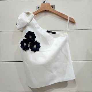 Atelier Debbie Co: White Assymetrical Ribboned Top With Swarovski Flower