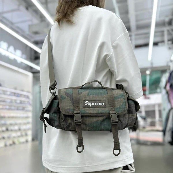 Supreme camo duffle bag store