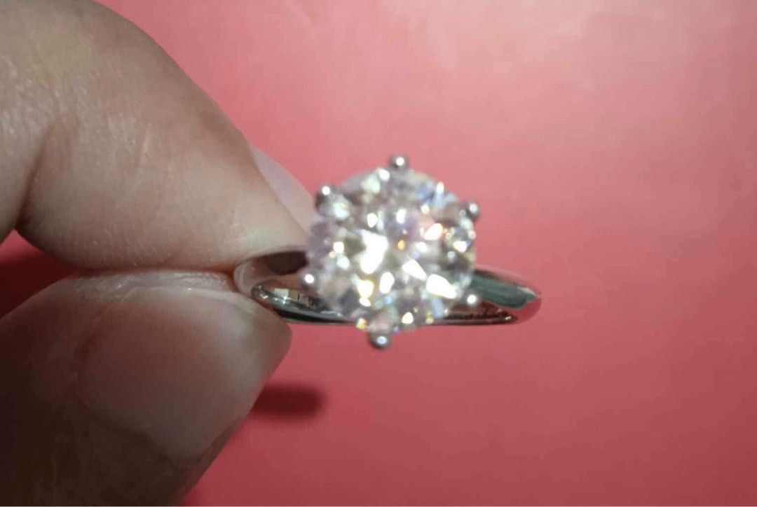 2ct. Moissanite Stone Engagement Ring S925 (Category: Rings) located in Caloocan City. Submitted by levres_good_collection07 (Listing ID 1290366416, Image 2). Description: 2.ct Moissanite Stone Engagement Ring 92.5 Sterling Silver Ring Size: Adjustable Stone size: 8mm Comes w/ Certificate Comes w/ Box.