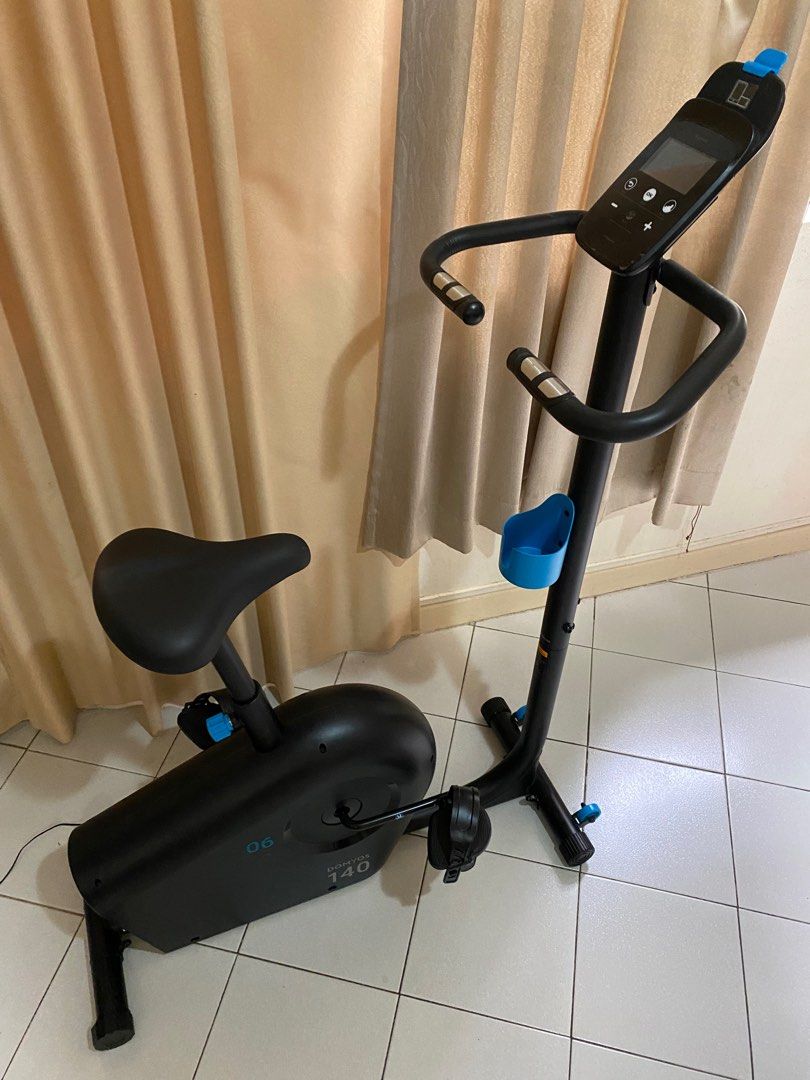 Stationary bike with top laptop holder