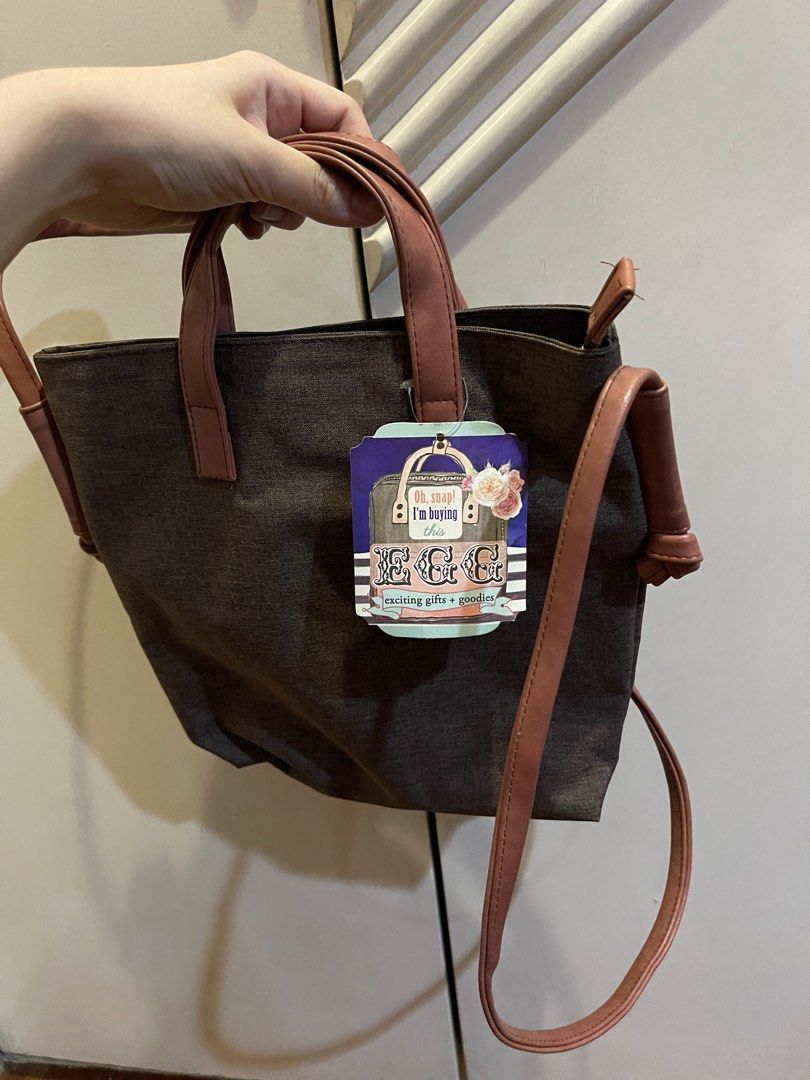 EGG Brown Sling Body Bag with Adjustable Strap and Handl (Category: Cross-body Bags) located in Manila. Submitted by allthelovekay (Listing ID 1290323020, Image 1). Description: Brand new bag with tag Adjustable straps Zipper enclosure Functional pockets inside Bought for ₱1,299.