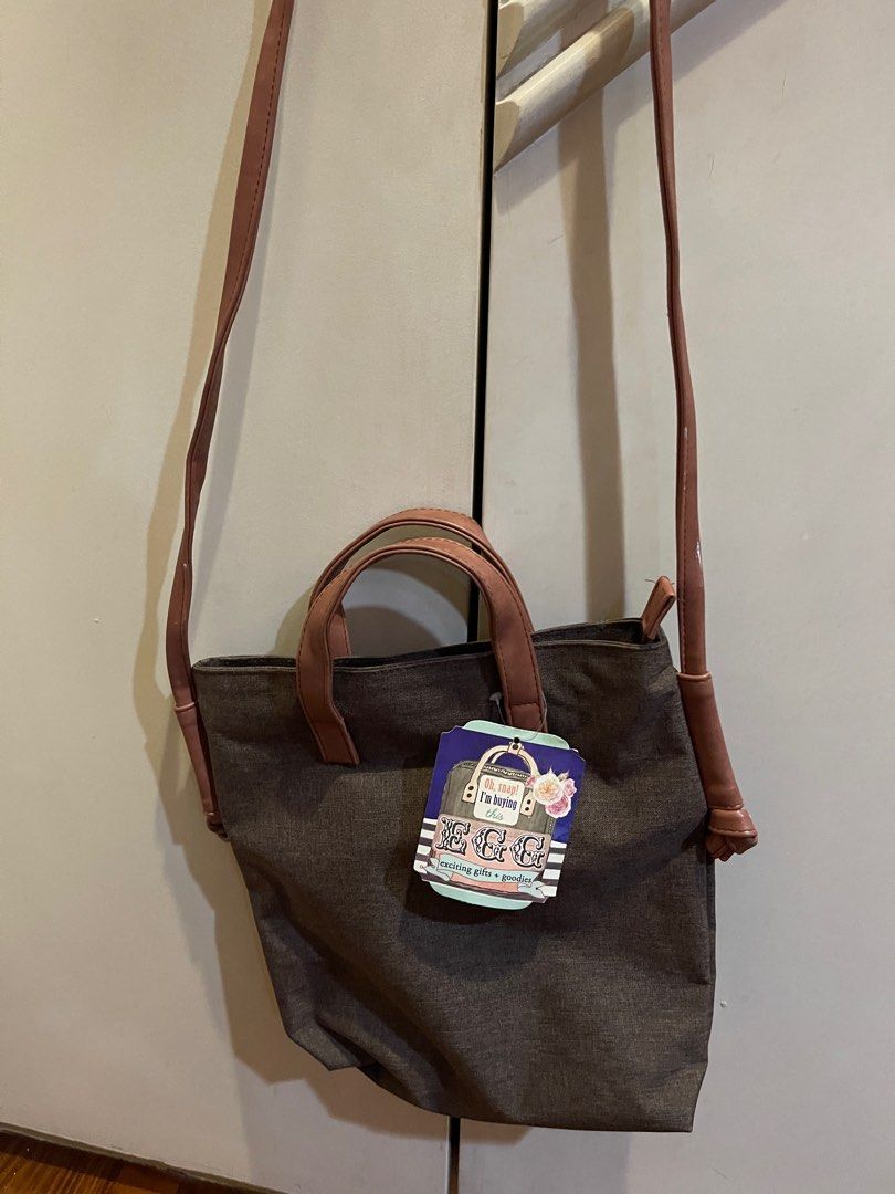 EGG Brown Sling Body Bag with Adjustable Strap and Handl (Category: Cross-body Bags) located in Manila. Submitted by allthelovekay (Listing ID 1290323020, Image 2). Description: Brand new bag with tag Adjustable straps Zipper enclosure Functional pockets inside Bought for ₱1,299.