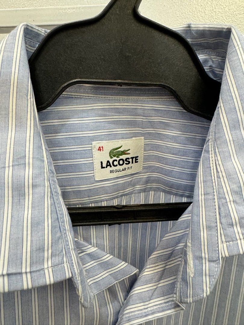 Lacoste Blue stripe Longsleeve (41) (Category: Formal Shirts) located in San Juan City. Submitted by danielnavvvvarro (Listing ID 1290369804, Image 2). Description: ‼️ READ ME ‼️ - Dimes: L 30 x W 21 - 41 on tag - Shipping shouldered by the buyer - MOP: Gcash/BPI - 2 days reservation MAX. - STRICTLY NO RETURNS, REFUNDS, CANCELLATIONS 📌COMING FROM BINONDO MANILA 📌SHIPPING SHOULDERED BY BUYER 📌CAN DO GRAB/LALAMOVE/ OTHER COURIERS 📌JT&T/ OTHERS 
