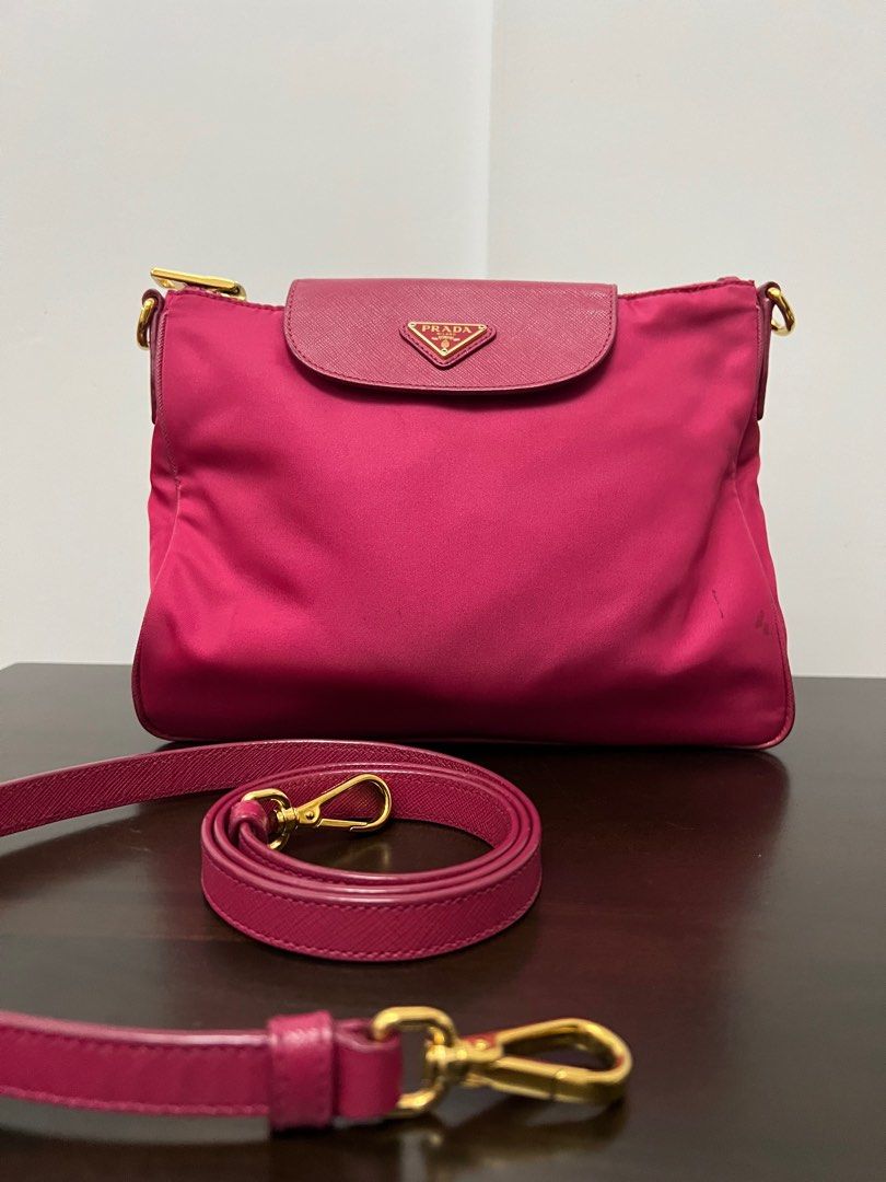 Prada Fuchsia Pink Nylon Sling Bag (Category: Luxury Bags & Wallets) located in Binan City. Submitted by ga_closet (Listing ID 1290423092, Image 1). Description: Comes with dustbag and strap. Has dirt and rubs on the corners but hardwares are okay. Pls see photos for details. .