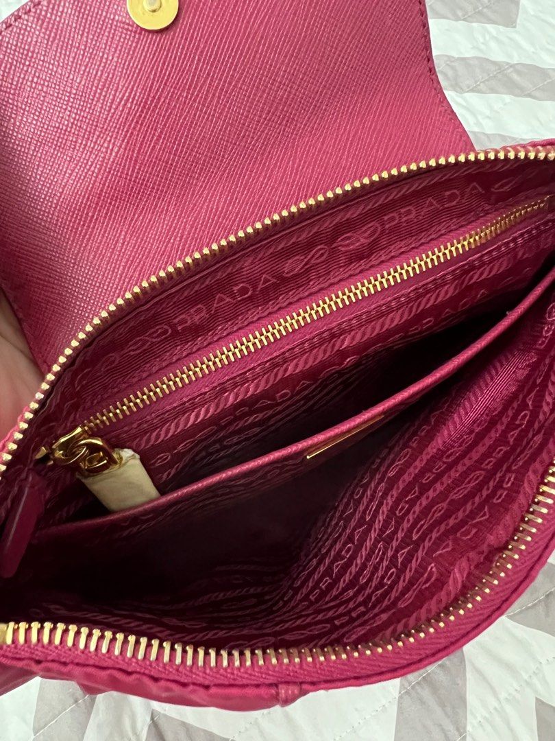 Prada Fuchsia Pink Nylon Sling Bag (Category: Luxury Bags & Wallets) located in Binan City. Submitted by ga_closet (Listing ID 1290423092, Image 2). Description: Comes with dustbag and strap. Has dirt and rubs on the corners but hardwares are okay. Pls see photos for details. .
