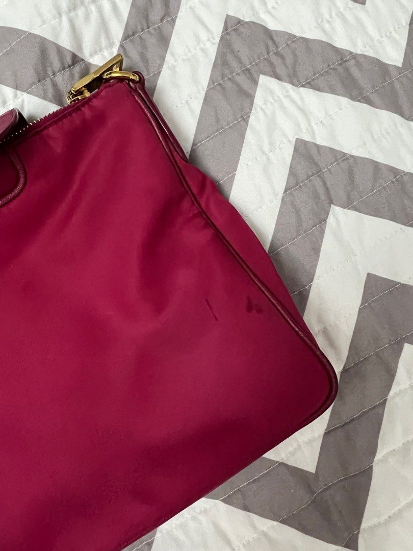 Prada Fuchsia Pink Nylon Sling Bag (Category: Luxury Bags & Wallets) located in Binan City. Submitted by ga_closet (Listing ID 1290423092, Image 3). Description: Comes with dustbag and strap. Has dirt and rubs on the corners but hardwares are okay. Pls see photos for details. .