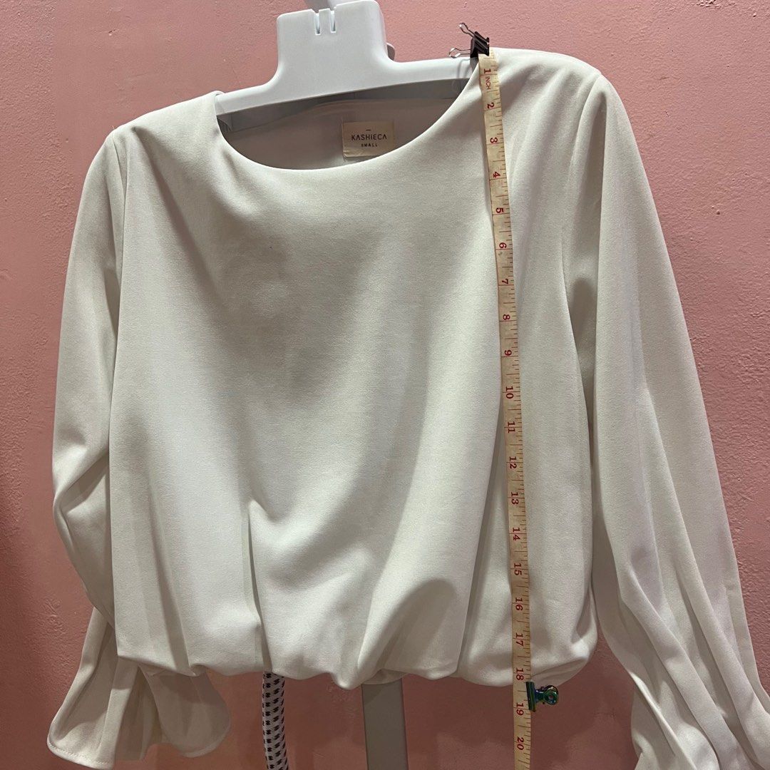 Kashieca White longsleeves Office top (Category: Longsleeves) located in Manila. Submitted by zannedeclutters (Listing ID 1283966066, Image 2). Description: ‼️‼️‼️PLEASE READ FIRST👇🏼 Measurements are already included in the photos. RFS: not using anymore. Na-stuck nalang sa cabinet. With black dots (not sure if removable) Please manage your expectations Shipping: Mon-Fri: pickup point from Avida Towers San Lazaro / SM San Lazaro Shipping via Gr