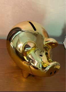 SWATCH gold piggy bank