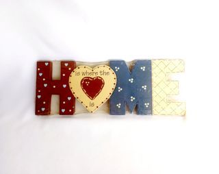"HOME is where the 🖤 is" wall hanging, painted solid wood, 3.75 in. L x 10.25 in. W, in original packaging