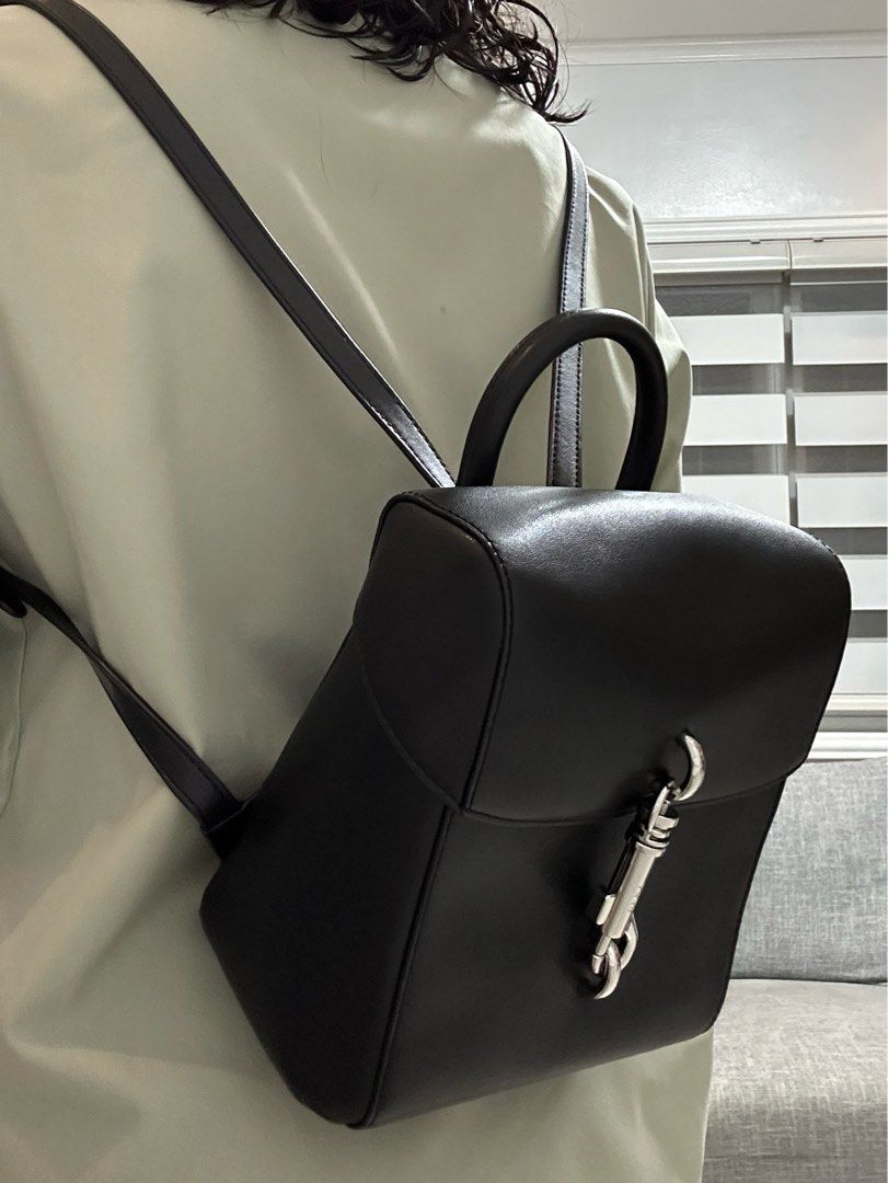 DKNY Mini Leather Backpack (Category: Luxury Bags & Wallets) located in Paranaque City. Submitted by outfit.repeater (Listing ID 1281499110, Image 2). Description: Authentic DKNY Women’s Ink Leather Mini Backpack Black | Silver-tone exterior hardwares Product Details: 8” width x 8”height x 4-1/2”depth lock closure | 1 interior zip pocket and 1 open pocket can fit a tablet (size 8”-10”) Comes with its original dust bag .