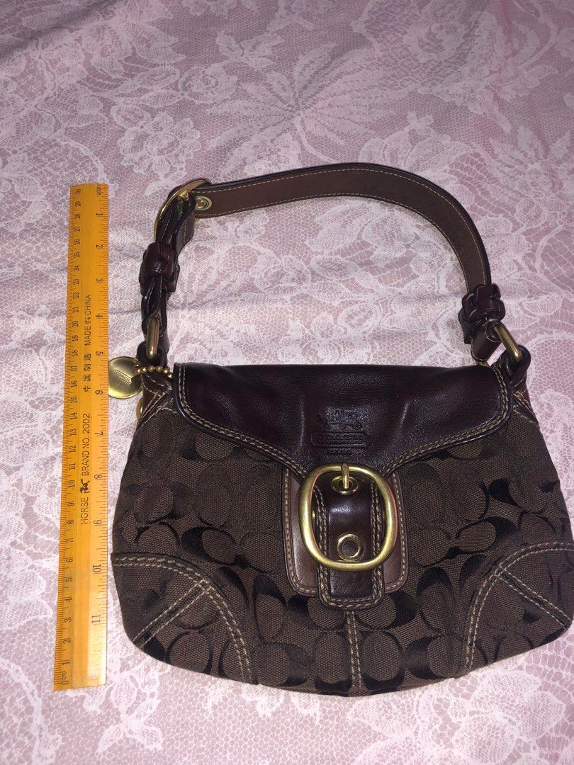 Coach Kili Shoulder Baguette Bag (Category: Luxury Bags & Wallets) located in Manila. Submitted by declutterwithyana (Listing ID 1284580836, Image 3). Description: Good as new, US bought Rfs: Decluttering Mahogany Color.