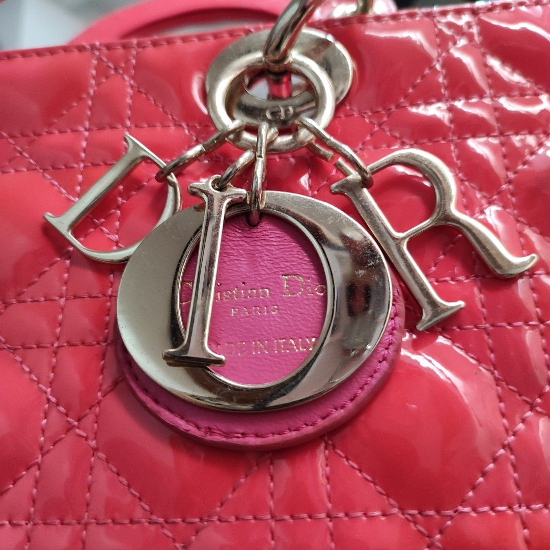 DIOR Pink Large Cannage Patent Leather Bag (Category: Luxury Bags & Wallets) located in Cavite. Submitted by yerbua103 (Listing ID 1284632865, Image 1). Description: 👛The lady Dior bag represents Christian Dior's vision of elegance and feminity. It is made with vibrant pink patent leather complimented with silver hardware. This classic style features the cannage detailing with the Dior charm. The top handle style comes with a detachable shoulder