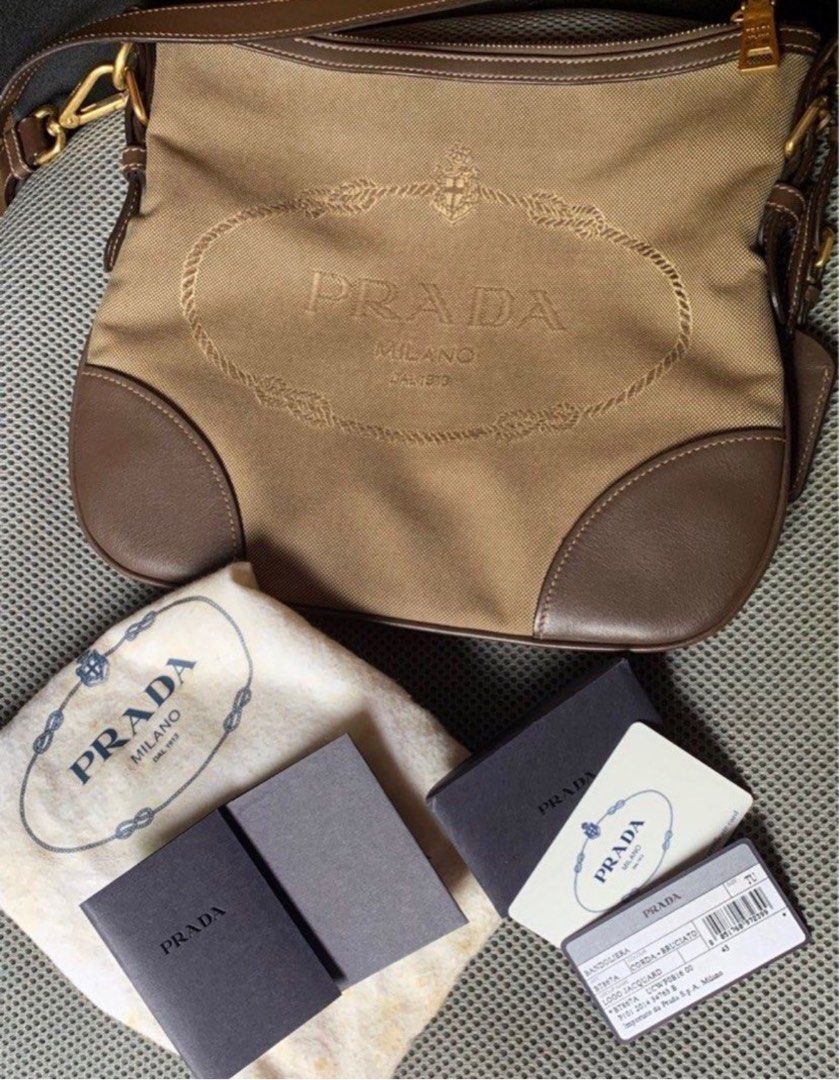 Prada Jacquard Sling (Category: Luxury Bags & Wallets) located in Santo Tomas. Submitted by mightypenguin_db692f (Listing ID 1284643463, Image 1). Description: 💯 Authentic or money back W/ dustbag and card Hindi masyado nagamit na stock lang sa cabinet. Send msg for pics .