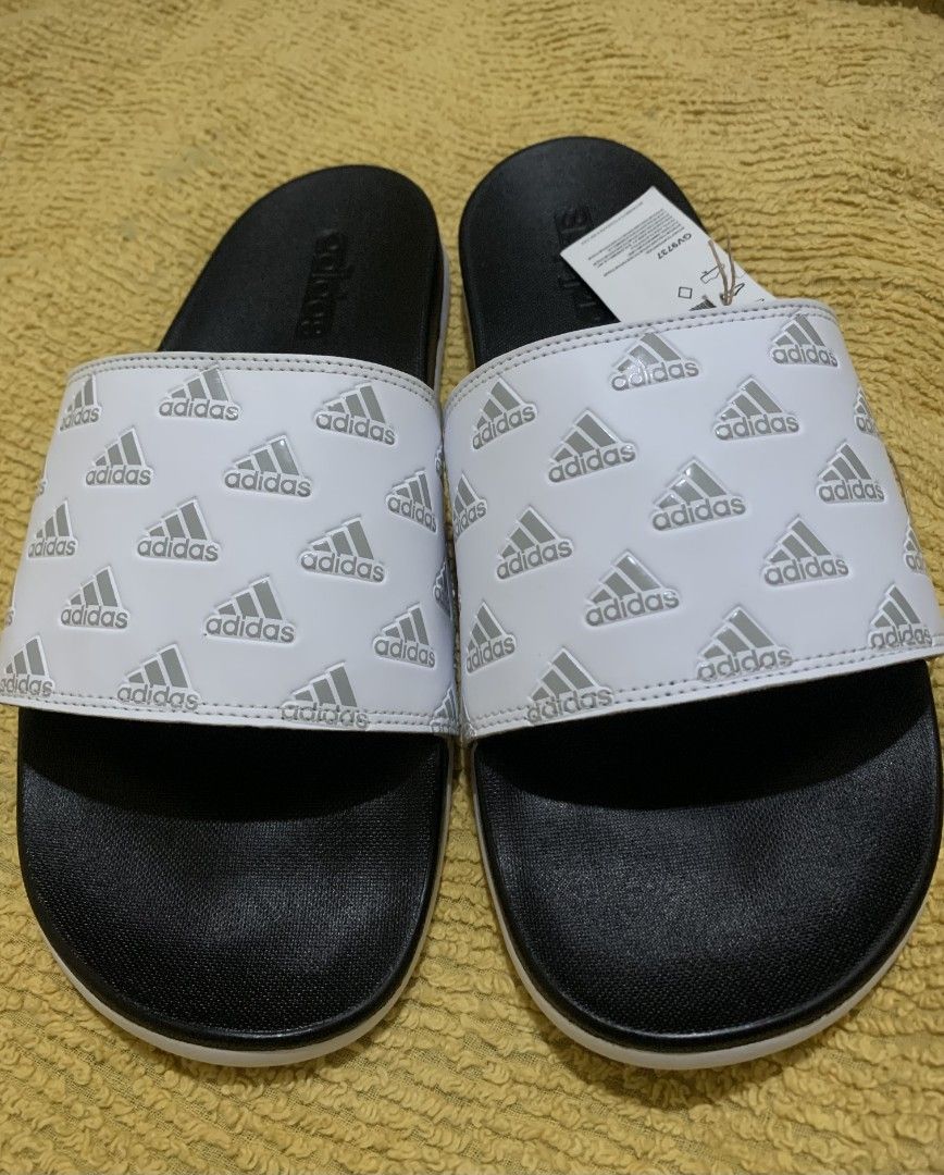 Original Adilette Comfort Slides/Cloud White (Category: Slippers and slides) located in Dasmarinas. Submitted by monching123 (Listing ID 1285049715, Image 2). Description: Original Adilette Comfort Slides/Cloud White/Grey Two/ Cloud White Size 10 GV9737 Lightweight and Contour Footbed Call Zero 907987 Three 032 Negotiable.