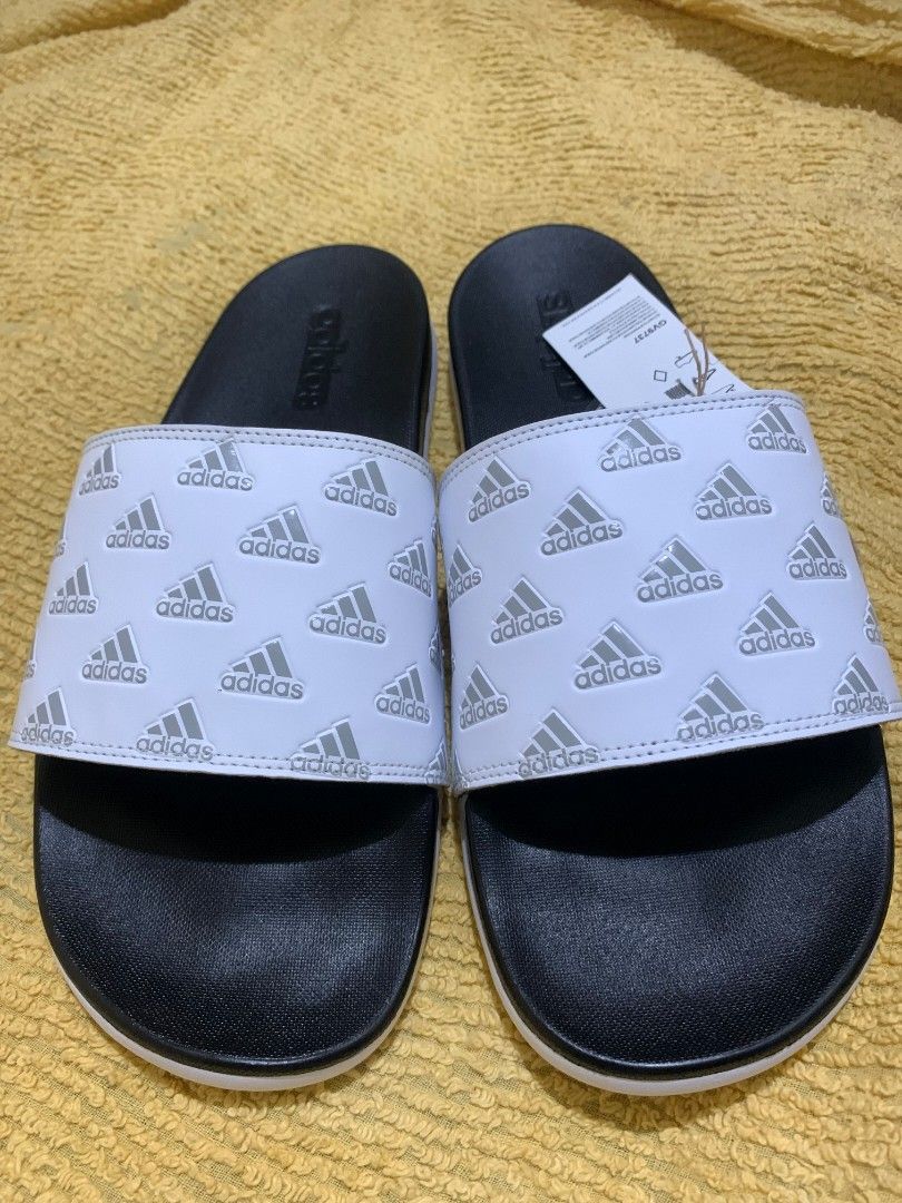 Original Adilette Comfort Slides/Cloud White (Category: Slippers and slides) located in Dasmarinas. Submitted by monching123 (Listing ID 1285049715, Image 3). Description: Original Adilette Comfort Slides/Cloud White/Grey Two/ Cloud White Size 10 GV9737 Lightweight and Contour Footbed Call Zero 907987 Three 032 Negotiable.