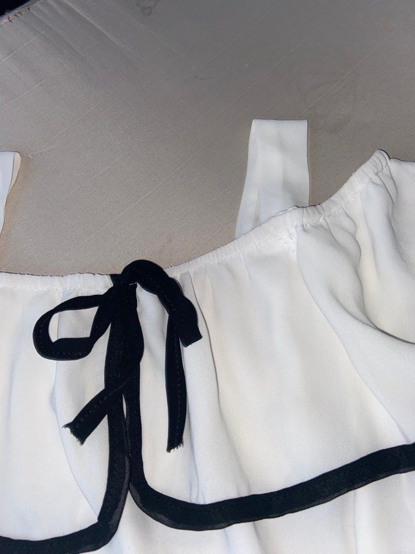 White Black Coquette Dainty Flowy Top (Category: Blouses) located in Makati City. Submitted by hellohell.o (Listing ID 1284859988, Image 2). Description: Iniksiian ko yung strap nito because mahaba sa akin, Ill try tanggalin yung tahi kapag ige-get na..