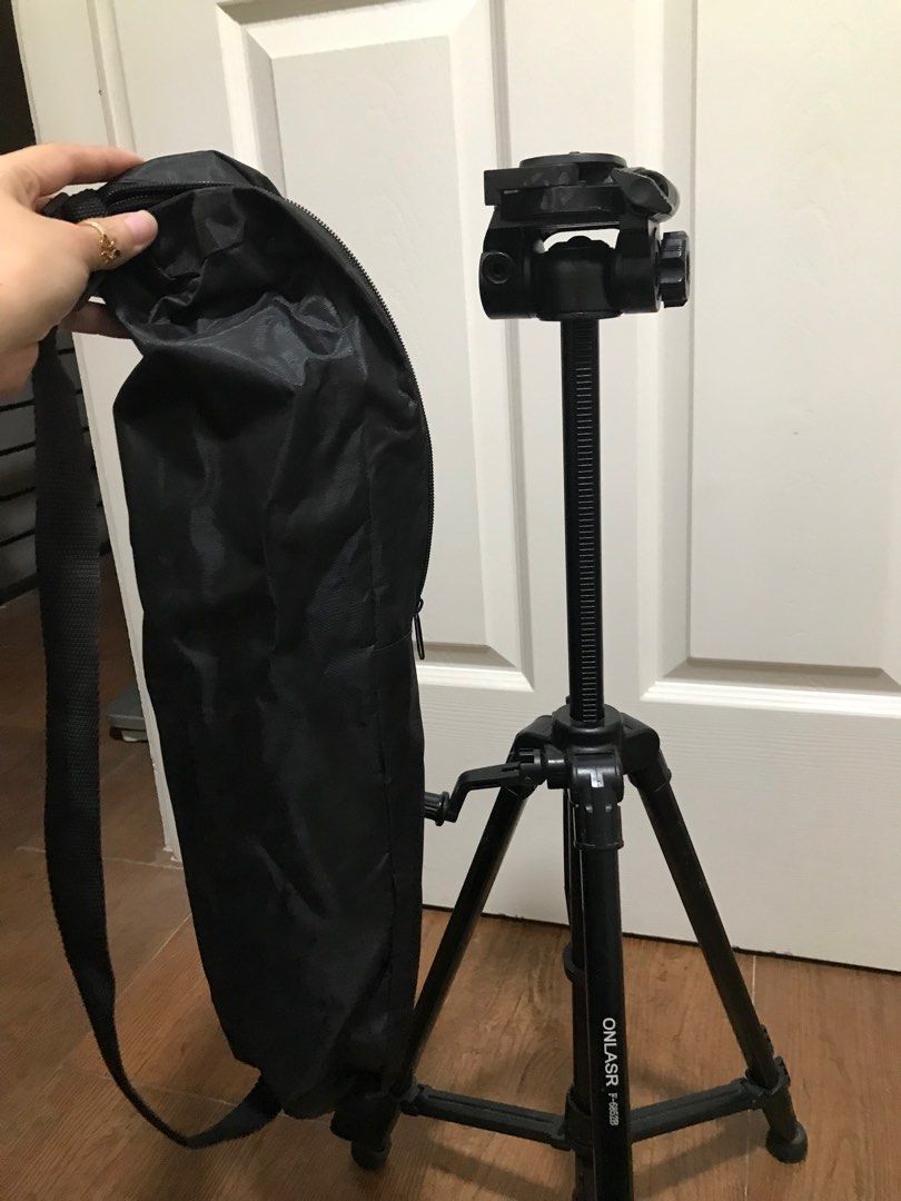 Adjustable tripod with tripod bag (Category: Tripods & Monopods) located in Las Pinas. Submitted by kate0_flower (Listing ID 1285153359, Image 1). Description: Rarely used RFS: decluttering Adjustable height of legs and neck with handle with balance liquid.