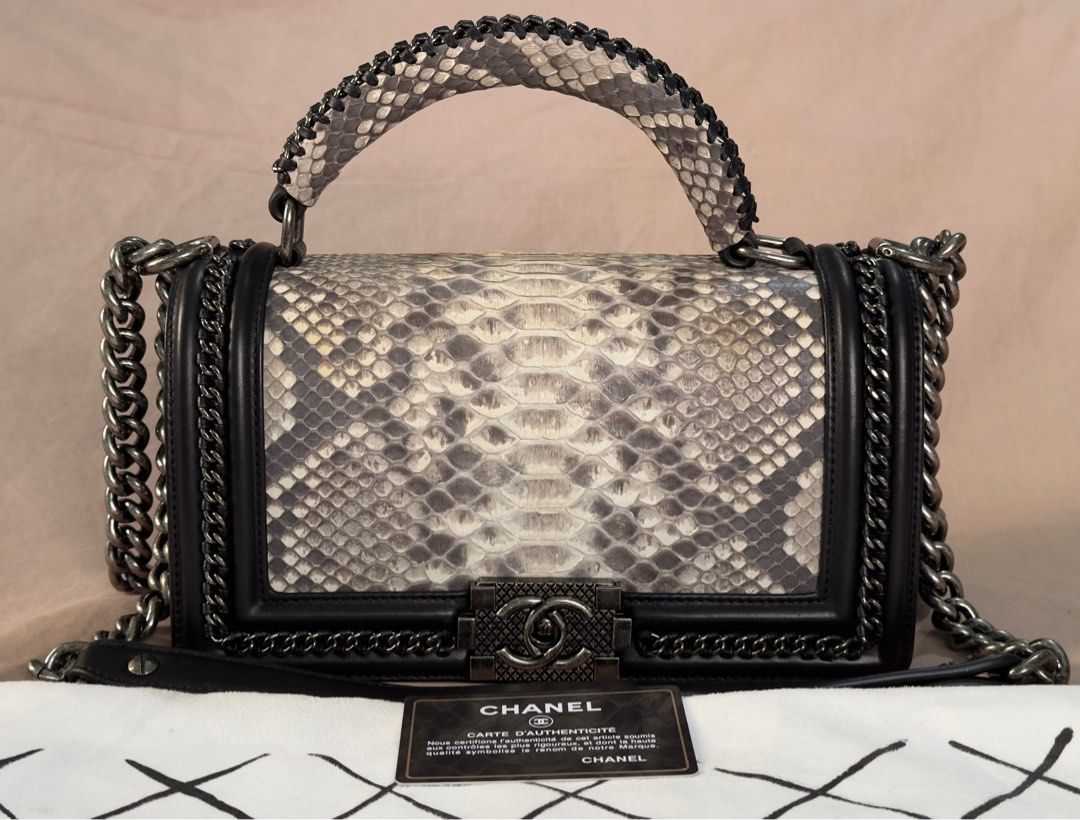 Chanel Le Boy Snake Skin Bag (Category: Luxury Bags & Wallets) located in Manila. Submitted by jpclassics (Listing ID 1285082004, Image 1). Description: Chanel Le Boy Snake Skin Bag with silver hardware. Japan sourced Authenticity not guaranteed Made in Italy In pristine condition. Black lambskin, snake skin front flap and top handle, with silver chain link and black leather padded shoulder strap. With Dust Bag Authenticity card got lost 2 mos ag