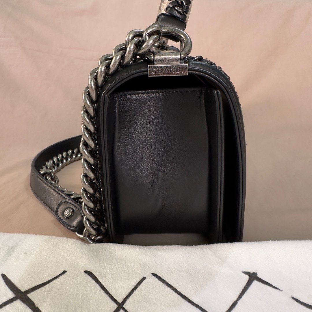 Chanel Le Boy Snake Skin Bag (Category: Luxury Bags & Wallets) located in Manila. Submitted by jpclassics (Listing ID 1285082004, Image 3). Description: Chanel Le Boy Snake Skin Bag with silver hardware. Japan sourced Authenticity not guaranteed Made in Italy In pristine condition. Black lambskin, snake skin front flap and top handle, with silver chain link and black leather padded shoulder strap. With Dust Bag Authenticity card got lost 2 mos ag
